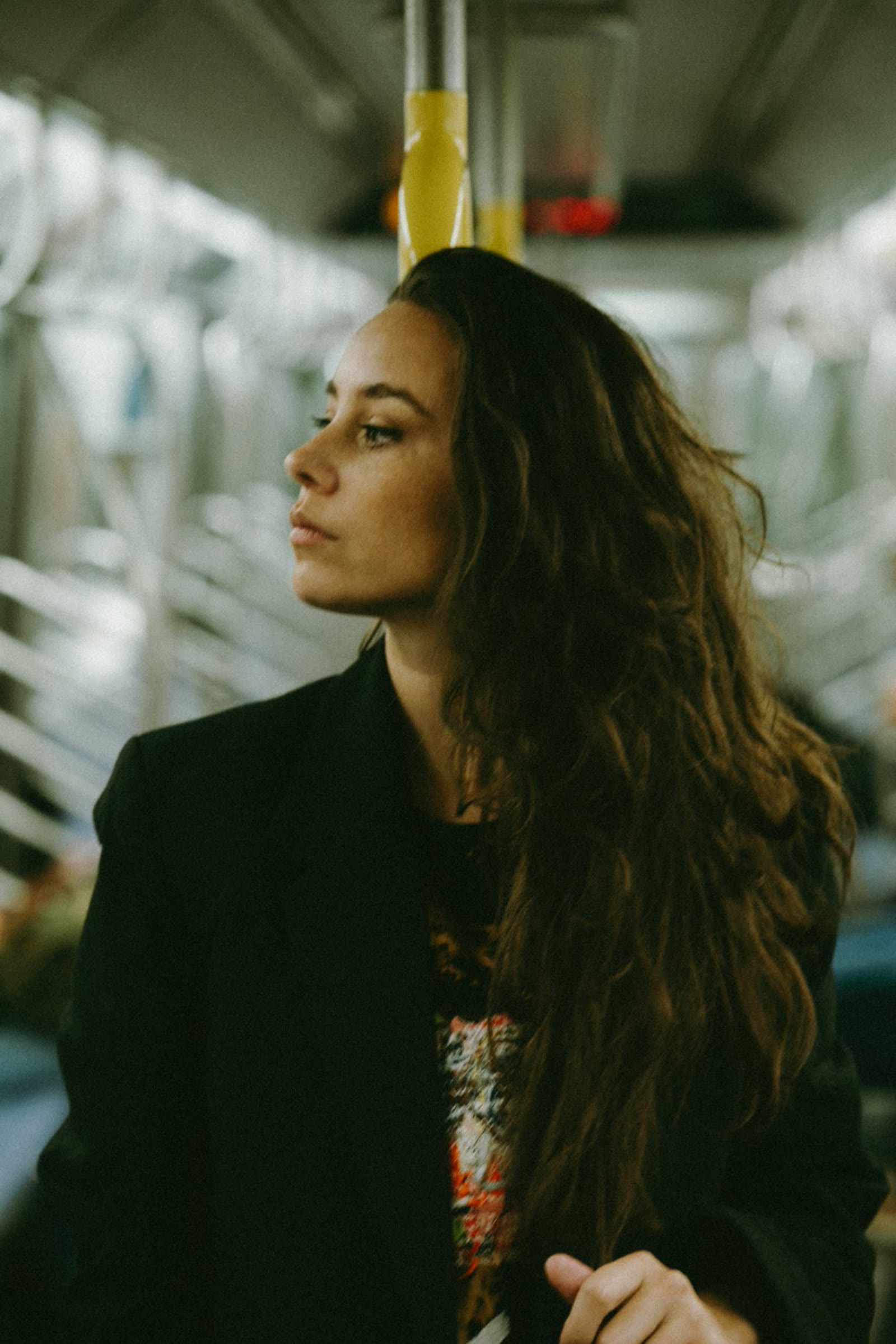 Rachelle, founder of Revenir, in a New York subway car